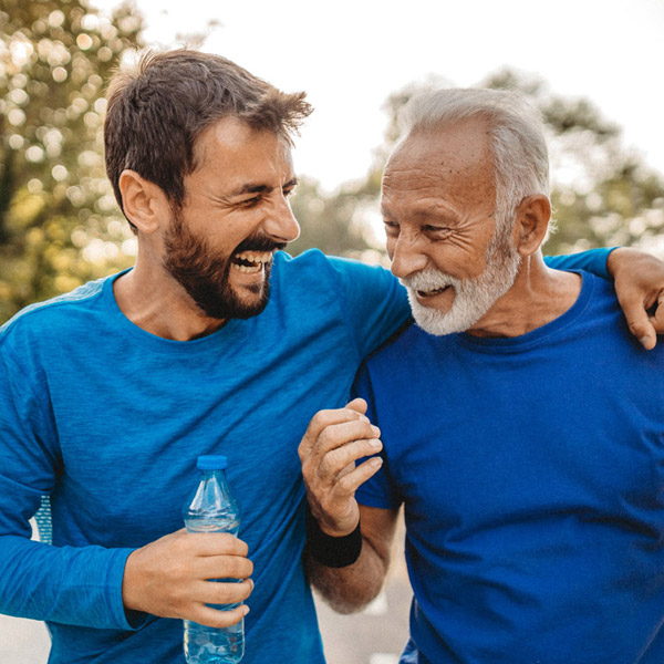 two men running outside together