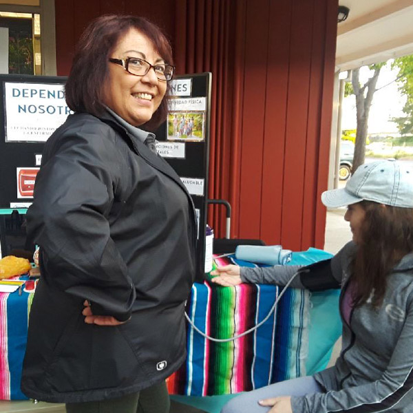 Michelle working a booth at an event