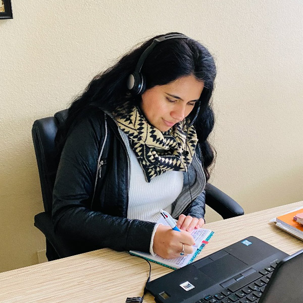Cristina Chavez working at a desk