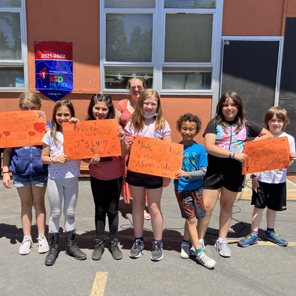 group of children holding up signs