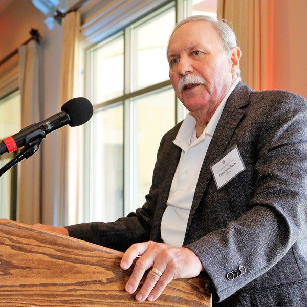 Erickson giving a speech on his success