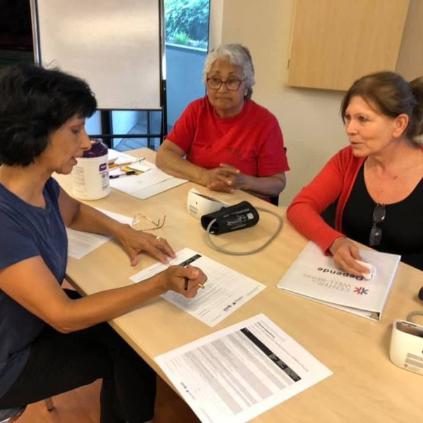 women going over forms in an office